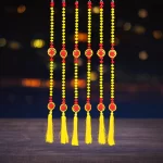 red-and-yellow-pompom-diwali-latkan-for-home-door-decoration-wall-hanging