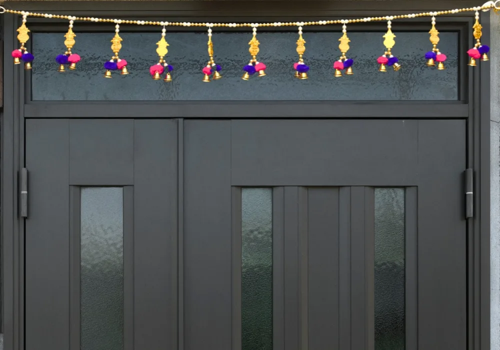 golden-door-toran-with-pom-poms-bells
